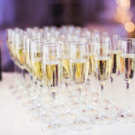 Pouring champagne into champagne flutes on a celebration event